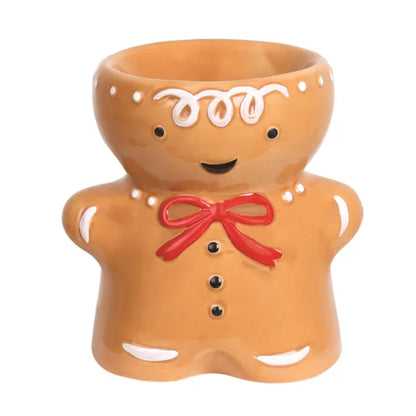 Ceramic gingerbread man wax melt and oil burner with a red bow tie on a white background