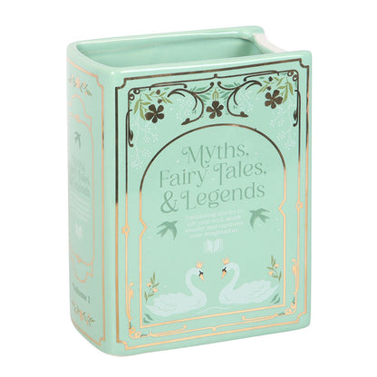 Mint green book shaped vase with 'Myths, Fairy Tales & Legends' text and swan illustrations on a white background