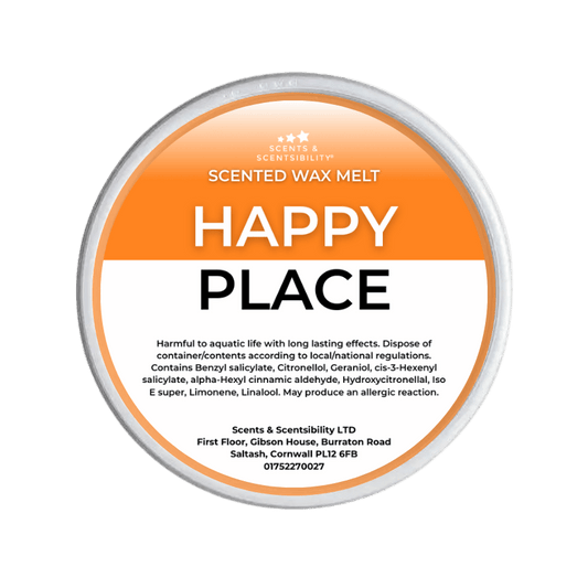 Scented wax melt container labeled 'Happy Place' on a green background