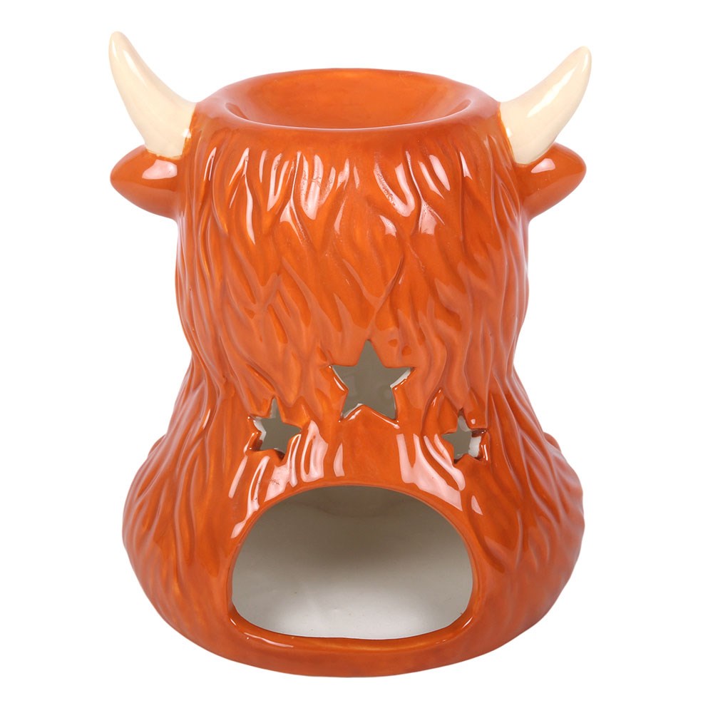Rear view of the Highland Cow Wax Melt and Oil Burner showing the tealight opening, decorative star-shaped cut-outs and ceramic dish for wax melts or fragrance oils.