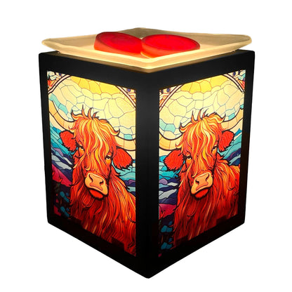Decorative wax warmer with stained glass design of a cow on a white background