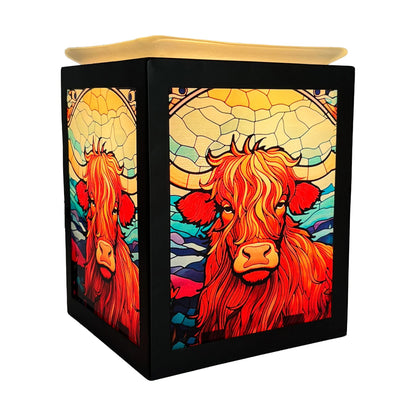 Square wax warmer with colorful cow design on a white background