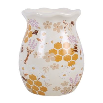 White ceramic Honey Bee Fluted Wax Warmer & Oil Burner featuring golden honeycomb, honey bees, white daisies and soft purple flowers with a wavy fluted rim.