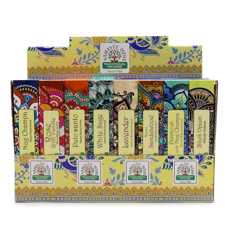 Colorful box of traditional incense sticks with various scents on a white background