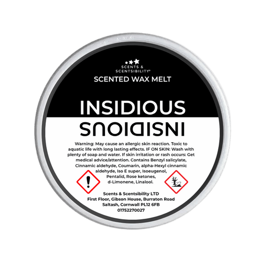 Scented wax melt container with 'Insidious' label on a green background