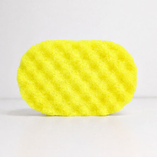 A textured, yellow sponge, filled with soap on a white background