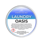 A round white plastic tub of Scents & Scentsibility 'Laundry Oasis' scented wax melt, shown against a solid dark green background.