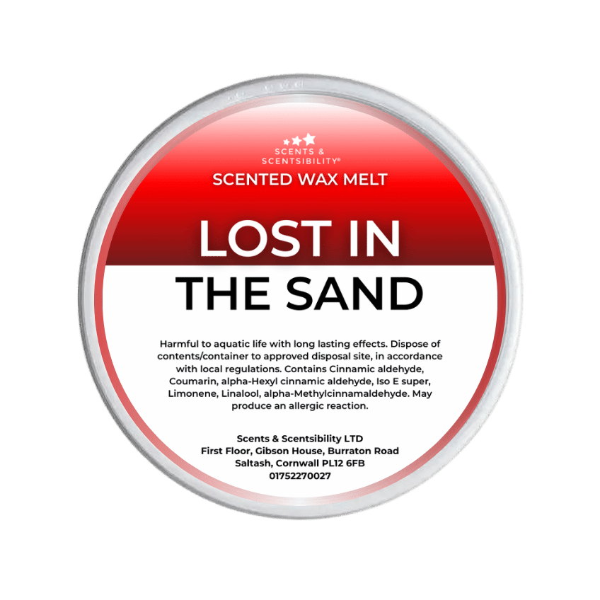 Scented wax melt container labeled 'Lost in the Sand' with Scents & Sensibility branding on a green background.
