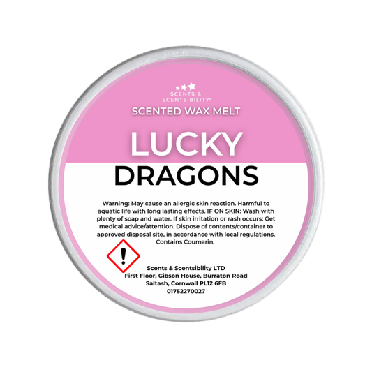 Scented wax melt container labeled 'Lucky Dragons' on a green background