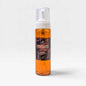 A clear plastic pump bottle filled with amber-orange liquid, featuring a white pump and a dark brown label that reads 'Mahogany & Teakwood'. The bottle is centered against a clean, light gray background with a soft shadow.