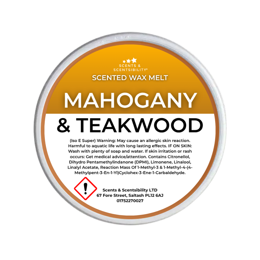 A round tub of Scents & Scentsibility Scented Wax Melt in the 'Mahogany & Teakwood' scent, featuring a metallic gold and orange label with white text and a red hazard warning icon.