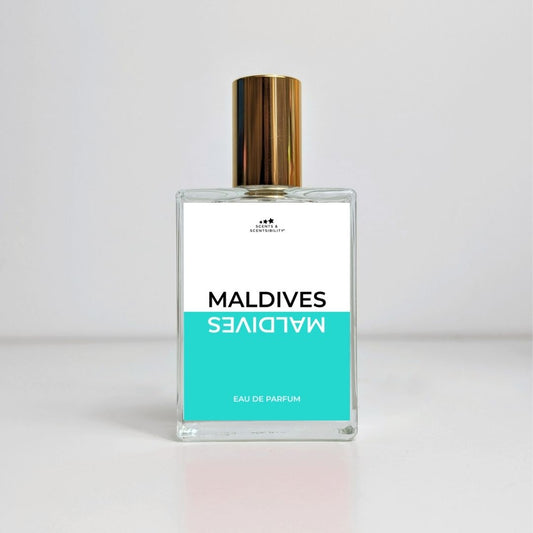 Perfume bottle labeled 'Maldives' on a light gray background