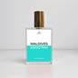 Perfume bottle labeled 'Maldives' on a light gray background