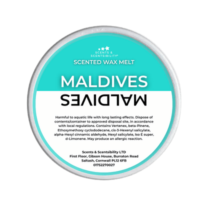 Scented wax melt container labeled 'Maldives' on a green background