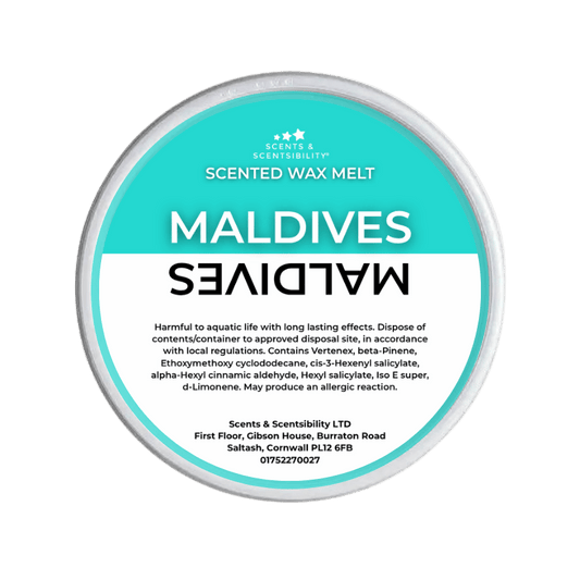 Scented wax melt container labeled 'Maldives' on a green background