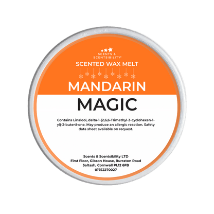 Scented wax melt container labeled 'Mandarin Magic' on a green background