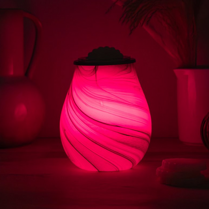 Red Wax Melt Warmer in a dark setting with blurred background