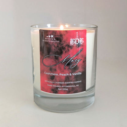 Candle with a red label on a white background