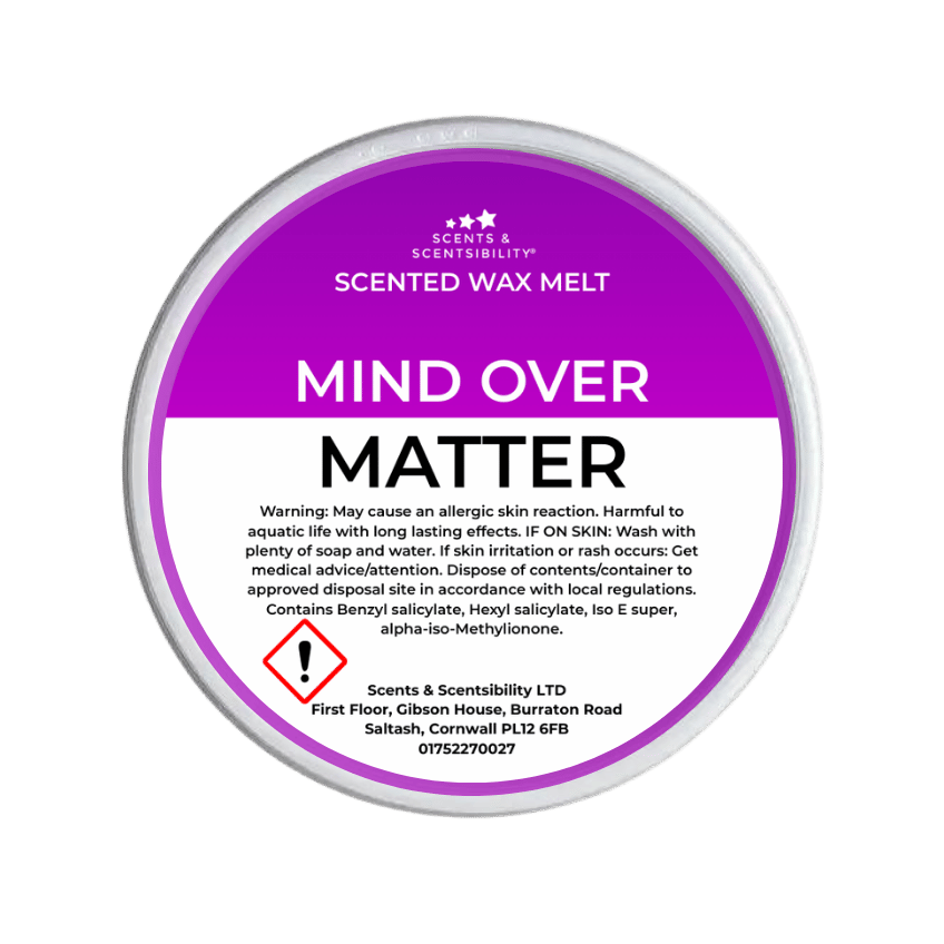 Scented wax melt container labeled 'Mind Over Matter' with purple and white design on a green background.