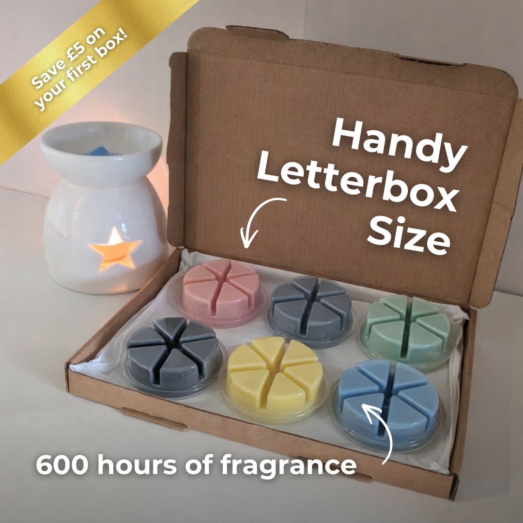 Box of scented wax melts with a candle, labeled 'Handy Letterbox Size' and '600 hours of fragrance'.