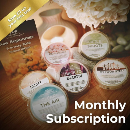 Wax Melts with a subscription flyer on a wooden surface
