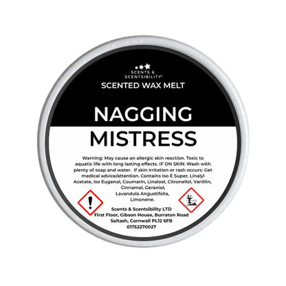 Scented wax melt container labeled 'Nagging Mistress' with branding and warning information.