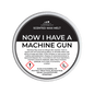 Scented wax melt container labeled 'Now I Have a Machine Gun' with warning text on a green background.