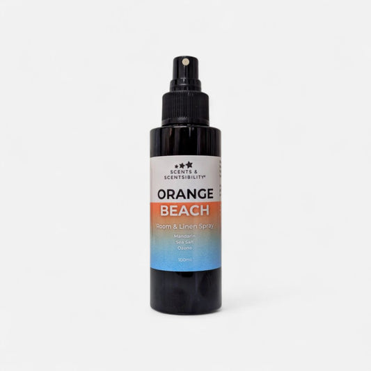 Bottle of 'Orange Beach' room & linen spray on a white background