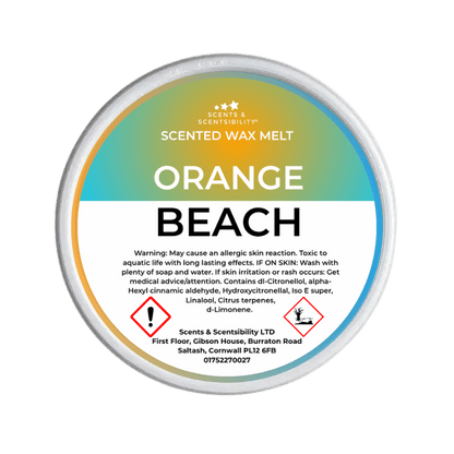 A pot wax melt labeled 'Orange Beach' with a description of the scent blend, including mandarin orange, sea salt, and ozone.