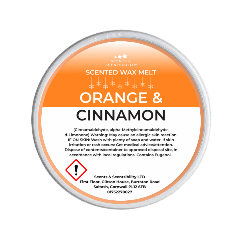 Scented wax melt container labeled 'Orange & Cinnamon' on a green background