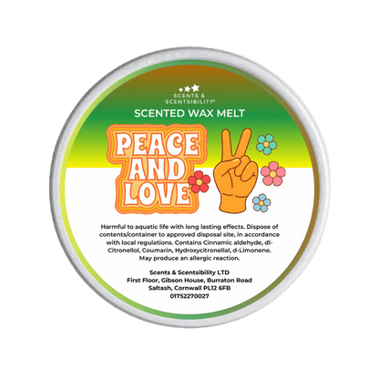 Scented wax melt container with 'Peace and Love' design on a green background