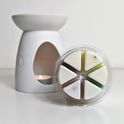 White Wax Burner with a wax melt on a white background