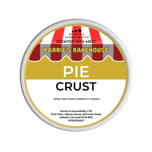 Scented wax melt container labeled 'Pie Crust' by Barrie's Bakehouse on a green background