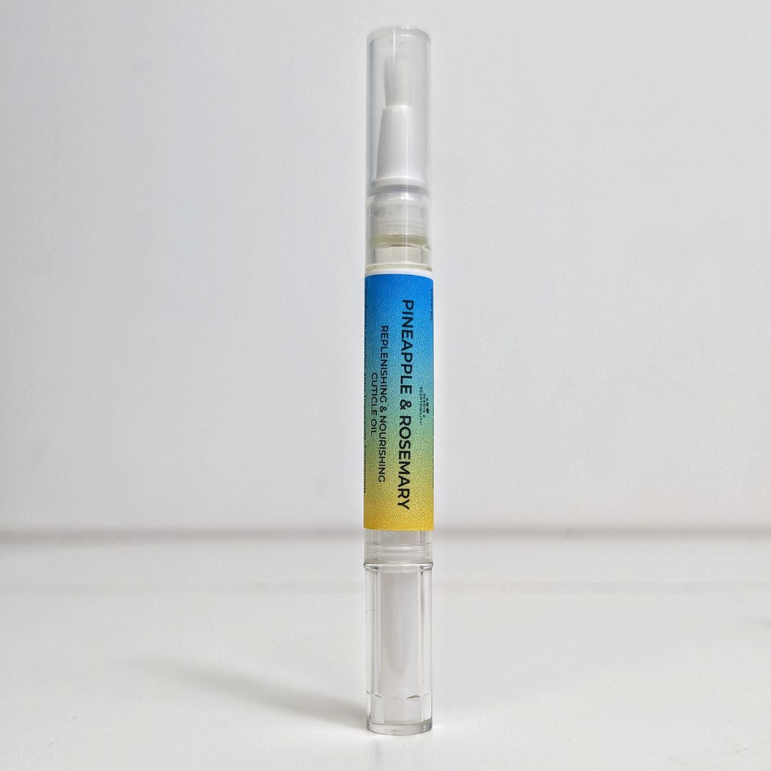 Pineapple & Rosemary Cuticle Pen with a gradient label on a white background