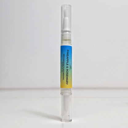 Pineapple & Rosemary Cuticle Pen with a gradient label on a white background
