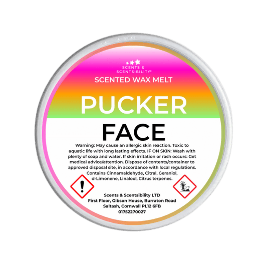 Scented wax melt container labeled 'Pucker Face' with a colorful label on a green background.