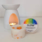 Candle, wax melt, and warmer with 'Rainbow Glow' label on a white background