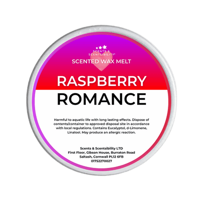 Scented wax melt container labeled 'Raspberry Romance' on a green background