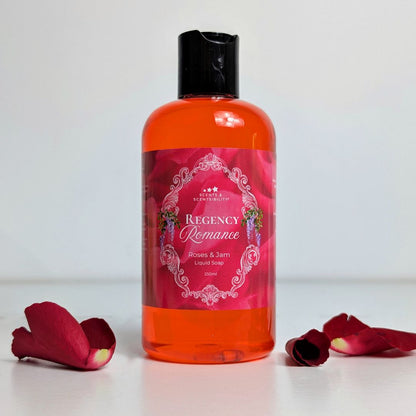 Bottle of 'Regency Romance' liquid soap with decorative label on a white background with rose petals