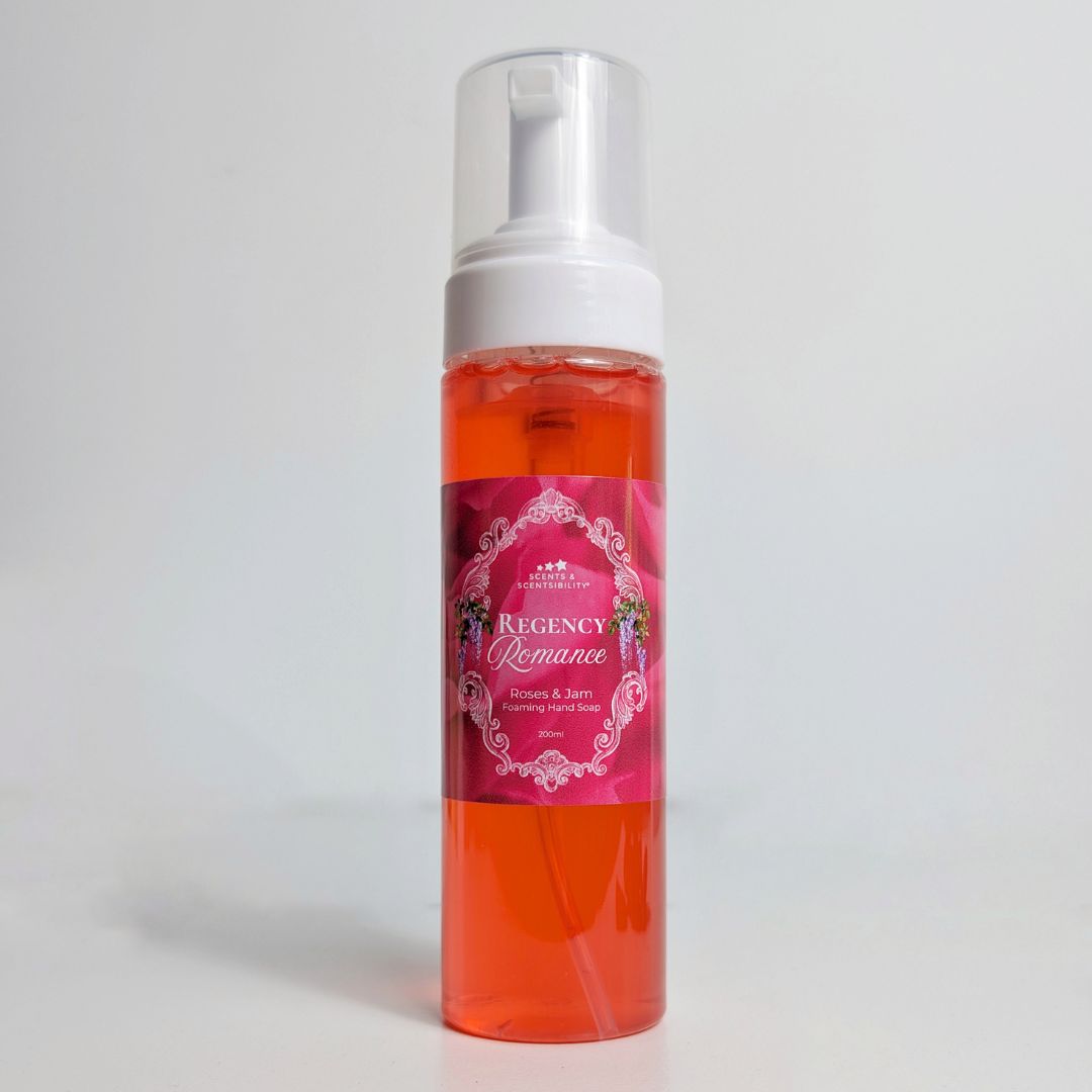 Red spray bottle with a pink label on a white background