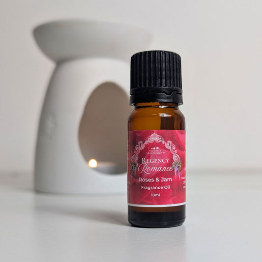 Bottle of Regency Romance Roses & Jam fragrance oil with a decorative label on a white surface.