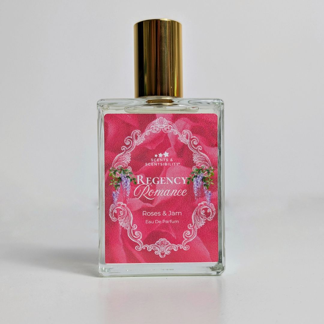 Perfume bottle with pink label on a light grey background