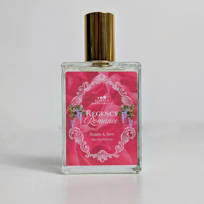 Perfume bottle with pink label on a light grey background