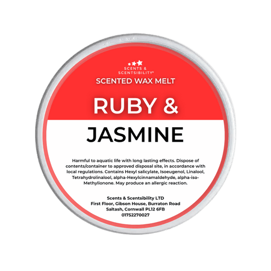 Scented wax melt container labeled 'Ruby & Jasmine' on a green background