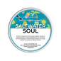 A round tub of Scents & Scentsibility 'Saltwater Soul' scented wax melt, featuring a colorful tropical beach illustration on a white and blue label, set against a solid dark green background.