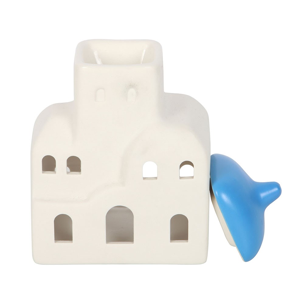 White building-shaped wax burner with a blue roof on a white background