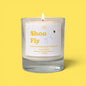 Candle labeled 'Shoo Fly' on a yellow background