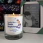 Candle with a label featuring a couple and the text 'Smells like a Book Boyfriend' next to a book titled 'The Love Hypothesis'.