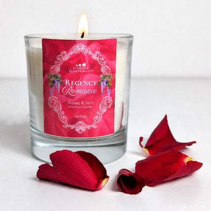 Scented candle labeled 'Regency Romance' with red rose petals on a white background