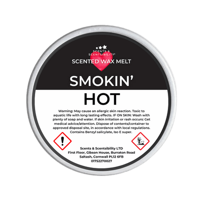 Scented wax melt container labeled 'Smokin' Hot' with branding and warning text on a green background.